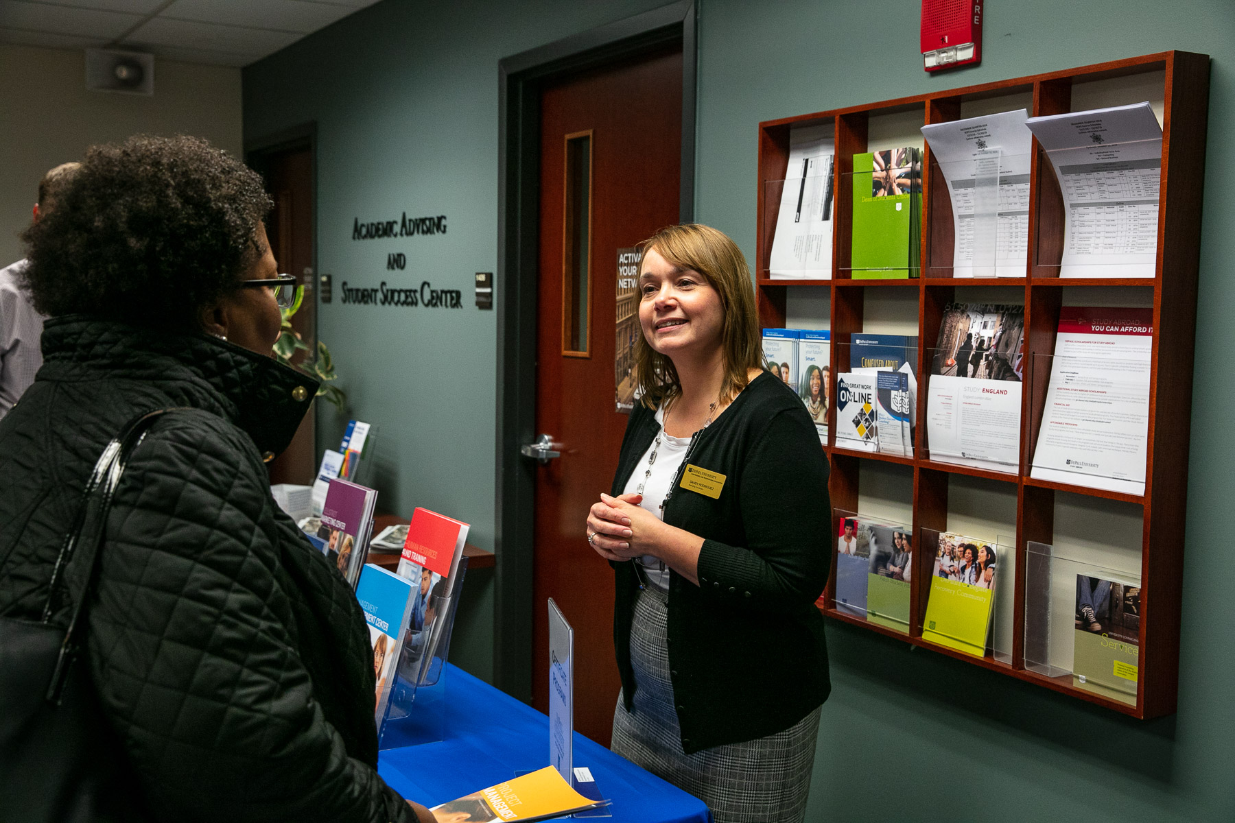Sandy Rodriguez, marketing communications specialist, shares information about resources available at the School of Continuing and Professional Studies. (DePaul University/Randall Spriggs)